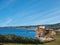 The Red House on top of the cliff on the edge of the water. Perce, Quebec, Canada