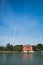 Red house by water, island of Mazzorbo, near Burano, Venice, Italy