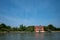 Red house by water, island of Mazzorbo, near Burano, Venice, Italy