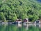 Red houses, Norwegian village, Water, forest fjord on a Sunny day, tourism, travel in Norway