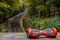 Red hoverboard against the background of railroad rails