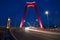 Red illuminated Willems Bridge in Rotterdam