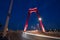Red illuminated Willems Bridge in Rotterdam