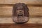 Red indian head Carved with wood hang on the brown wooden wall for interior and exterior decoration