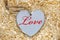 Red inscribed wooden love heart
