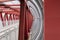 Red iron beams fastening the crosswalk. The channels are bolted, railing fencing, closed pedestrian crossing over the road