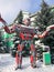 Red iron metal big strong dangerous fantastic, futuristic humanoid robot from a car with hands and head in winter