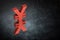Red Japanese of Chinese Currency Symbol or Sign With Mirror Reflection on Dark Dusty Background