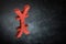 Red Japanese of Chinese Currency Symbol or Sign With Mirror Reflection on Dark Dusty Background
