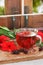 Red karkade hibiscus red sorrel tea in glass mug with dry tea cu