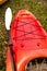Red kayak and white paddle close up
