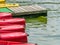 Red kayaks at the pier or dock on Mogosoaia lake, Romania