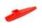 Red kazoo, plastic traditional musical instrument object isolated on white, cut out, closeup. Kids wind instruments with vibrating