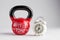 Red kettlebell with Workout Time lettering and traditional alarm