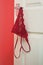 Red Knickers hanging off a bedroom door handle