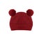 Red knitted baby hat with funny ears bear isolated on white