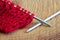 Red knitting wool, knitting needles