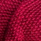 Red knitting wool texture background. Colorful knitted horizontal textured background.