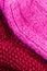 Red knitting wool texture background. Colorful knitted horizontal textured background.