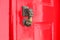 Red lacquered door with doorknocker