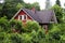 Red landscaping log cabin