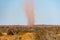 Red landspout whirlwind sand tornado dust devil in Australian dessert