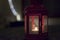 Red lantern with burning tealight