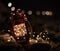 Red lantern with garlands on beach stones in dark night of Marbella, Malaga