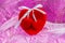 Red large heart with two small heart in pink background