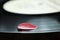 Red leaf on vinyl music plate