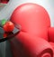 Red leather chair and apple