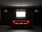 Red leather divan and bookcase with LCD tv