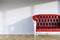 Red leather vintage sofa in modern room interior with hardwood a