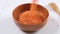 Red lentils in a bowl on white background. Healthy organic food diet concept