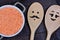 Red lentils in a ceramic pot with family wooden spoons
