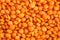 Red lentils forming a background pattern, healthy food