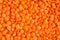 Red lentils. lentil texture pattern, background, macro