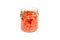 Red lentils pasta in glass jar, isolated.