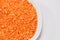 Red lentils, pulses on a white background