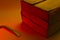 Red level of danger. The Mounting tool lies near the wooden box in bright red-orange light. Copy space. Attention, breaking in