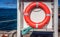 Red life saving buoy near the ocean