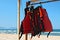 Red life vests on a sandy beach