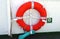 Red lifebuoy aboard ship,