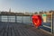 Red lifebuoy hanging on wooden pier, Jordan pond, Tabor, oldest dam in the Czech Republic, sunny autumn day, life insurance
