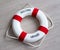 Red lifebuoy with welcome aboard text