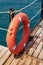Red Lifebuoy on wooden pier