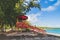 Red Lifeguard hut along shore of Seven Sea beach in tropical Fajardo Puerto Rico