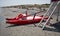 Red lifeguard rescue boat. The word `Salvataggio, Rescue` written on the boat. Riviera Romagnola, Italy