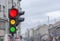 Red light with yellow and green semaphore city urban blury bg
