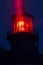 Red lighthouse illuminated